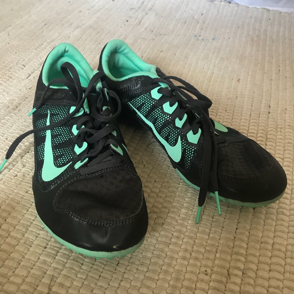 Used Twice! Nike teal and black track spikes!